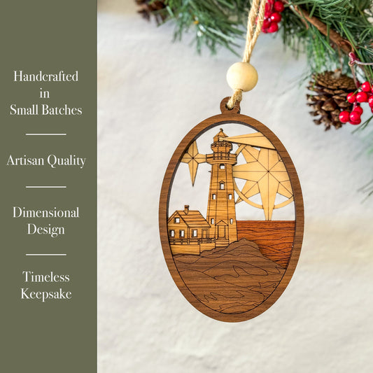 Wooden ornament with lighthouse design on a white surface with greenery.