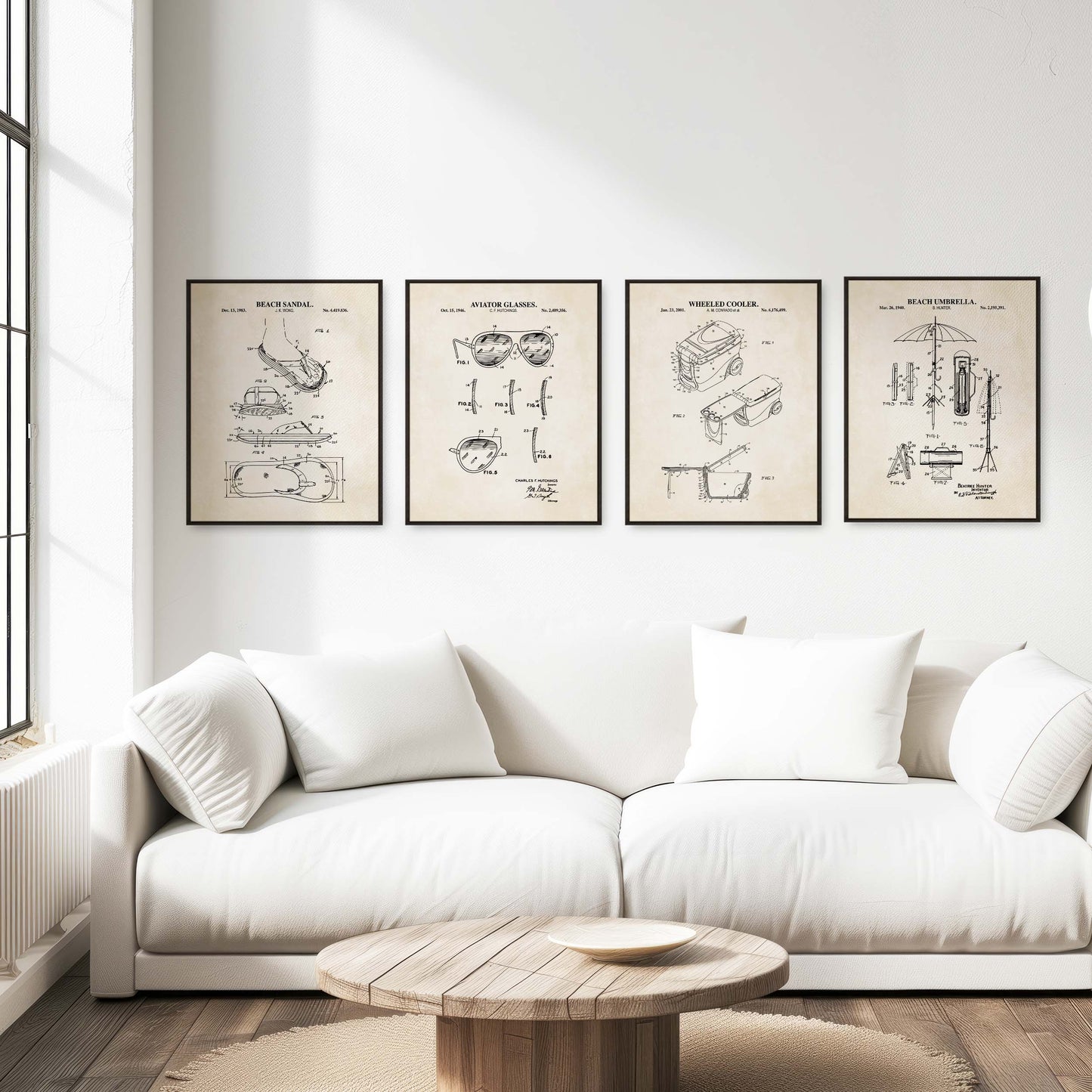 White sofa in a living room with four beach themed framed posters on the wall.