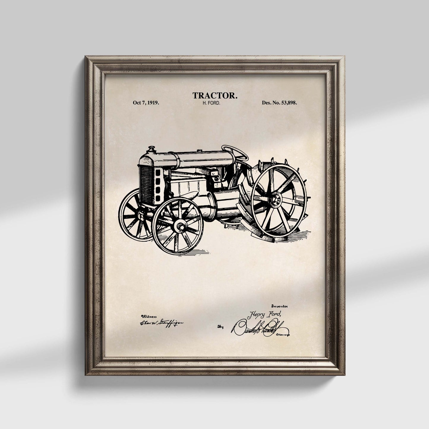 Framed vintage tractor patent print on a light background