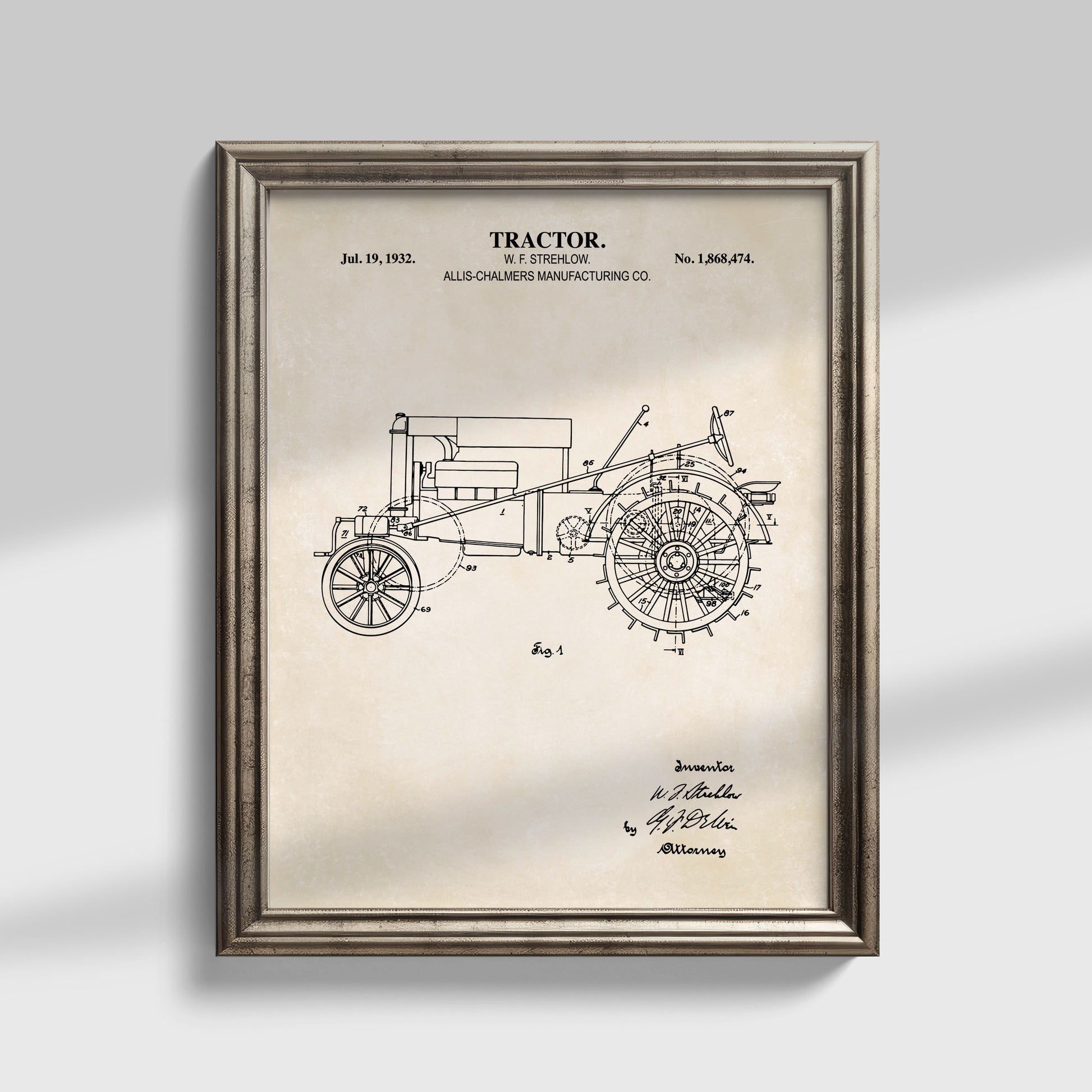 Framed vintage tractor patent print on a light gray background