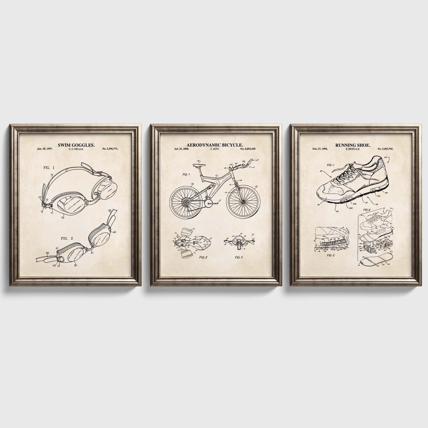Three framed triathlon themed patent posters on a white wall
