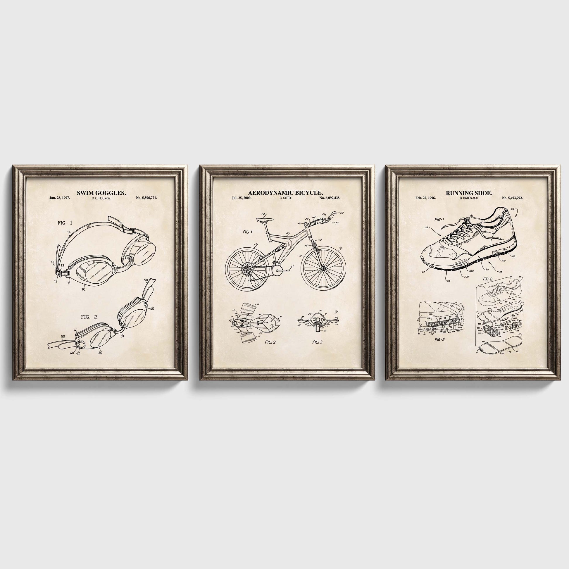 Three framed triathlon themed patent posters on a white wall