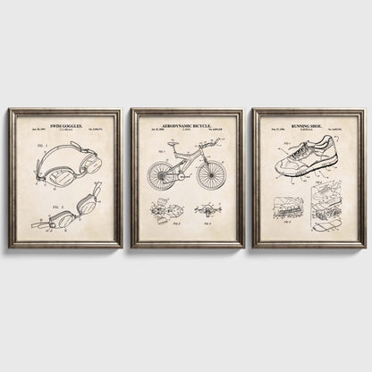 Three framed triathlon themed patent posters on a white wall