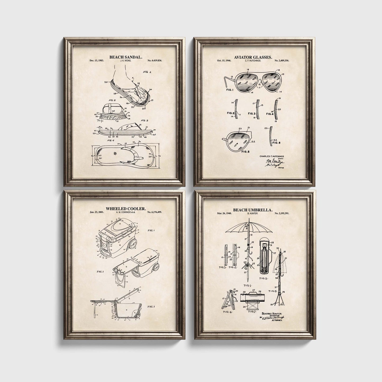 Four framed beach themed patent prints on a white wall