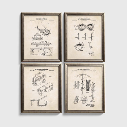 Four framed beach themed patent prints on a white wall