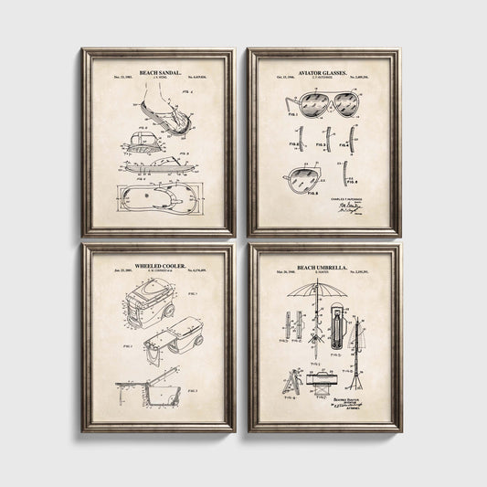 Four framed beach themed patent prints on a white wall