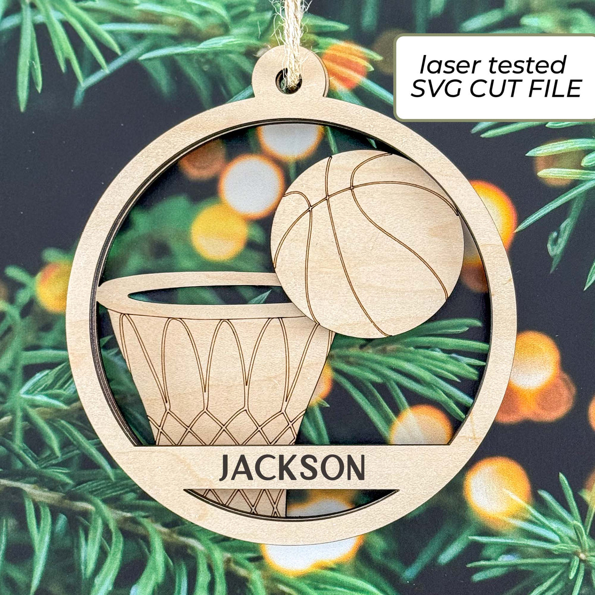 Basketball ornament SVG listing image showing a laser-cut wooden sample with a layered basketball, hoop, net and personalized player name.