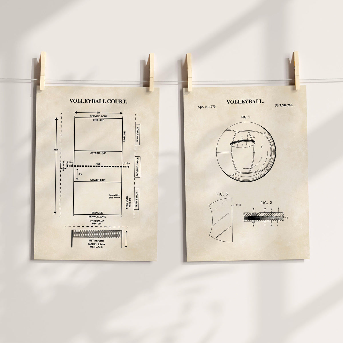 Two vintage-style volleyball-themed art prints clipped to a string with wooden clothespins against a light wall. The left print shows a labeled volleyball court diagram, and the right print shows a vintage patent-style illustration with the word VOLLEYBALL at the top.