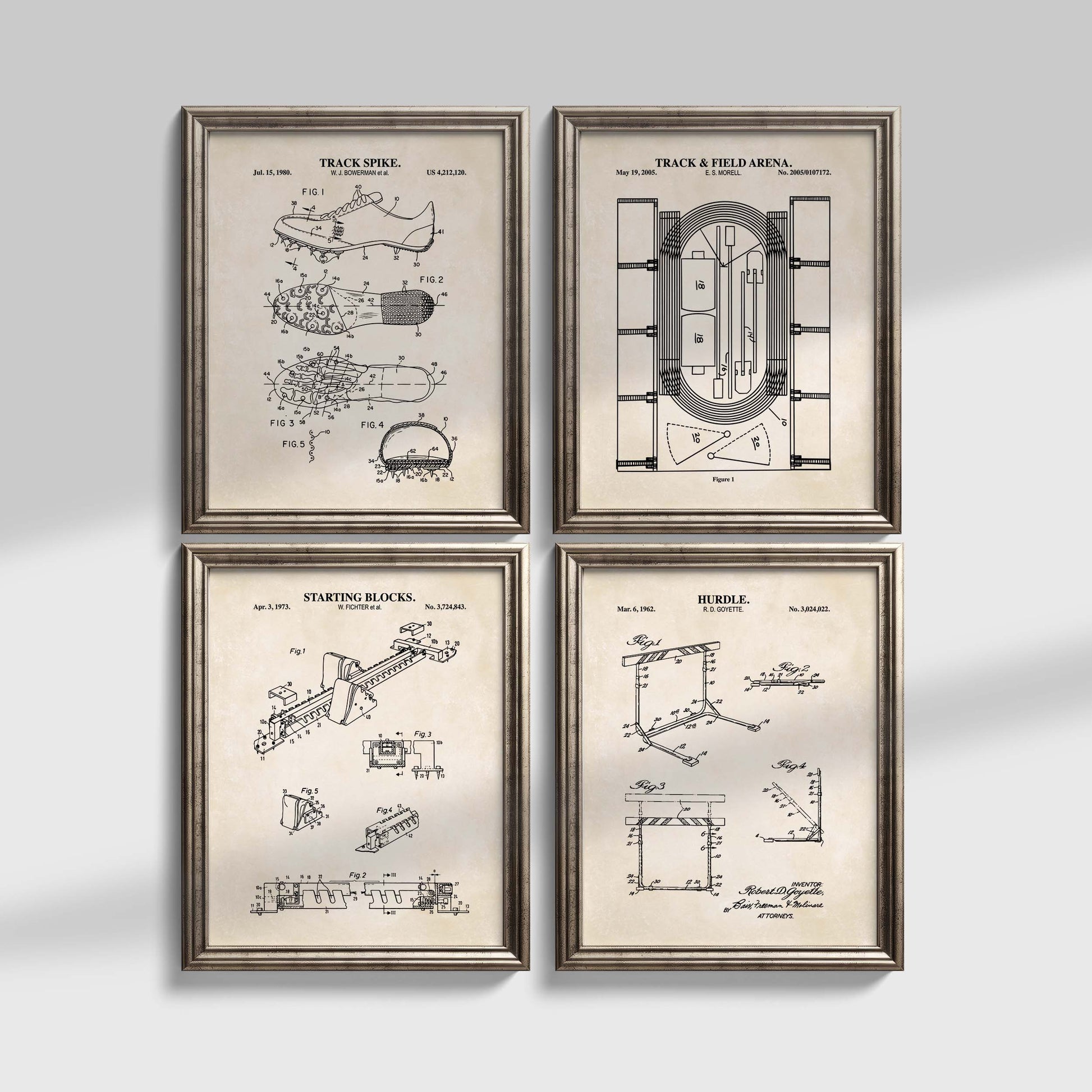 Four framed track and field prints with architectural drawings on a light gray background