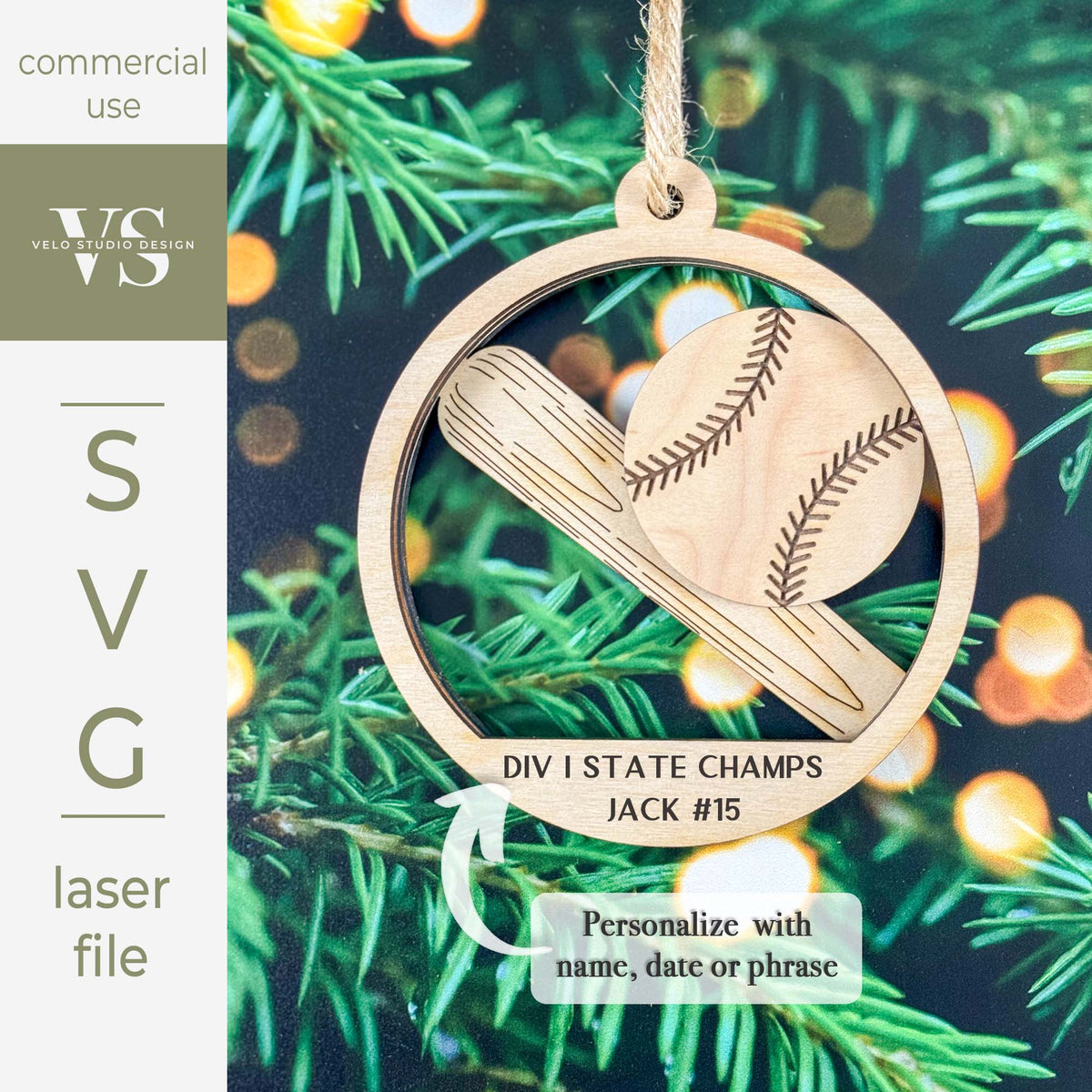 A circular wooden baseball ornament design shown hanging against evergreen branches with warm bokeh lights. The ornament features a laser-engraved baseball and bat motif with the text 'DIV I STATE CHAMPS JACK #15' and a note that says 'Personalize with name, date or phrase.