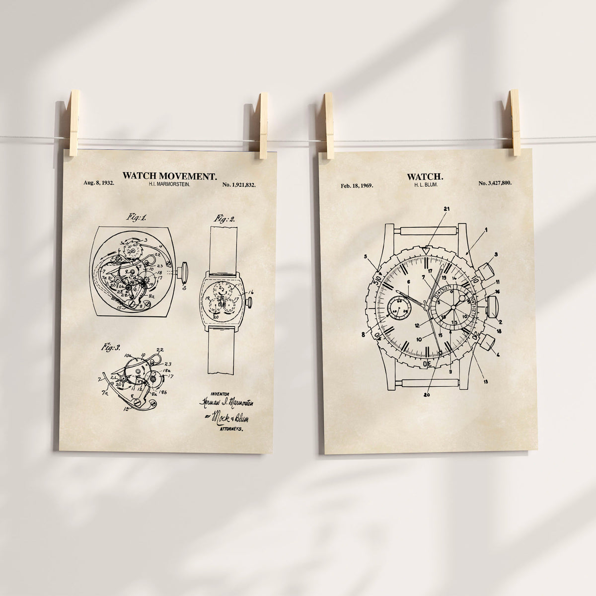 Two vintage watch patent prints on antique-style cream backgrounds