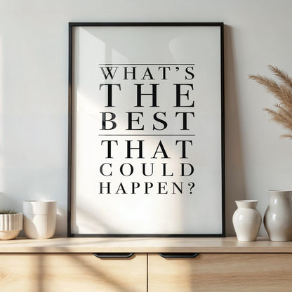 Framed poster with text 'What's the best that could happen?' on a wall above a wooden shelf with decorative items.