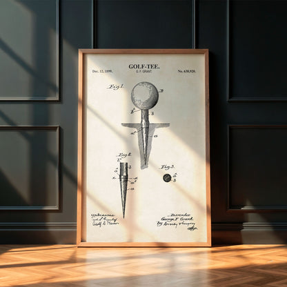 Framed vintage golf tee patent print on a wall.