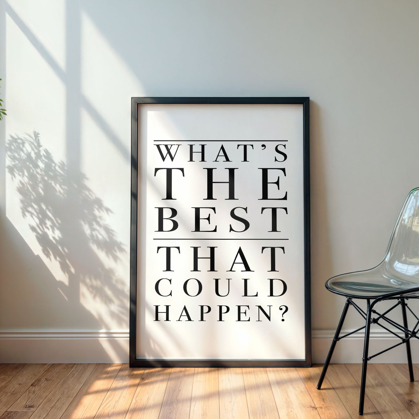 Framed poster with motivational quote 'What's the best that could happen?' in a room with a chair and sunlight.