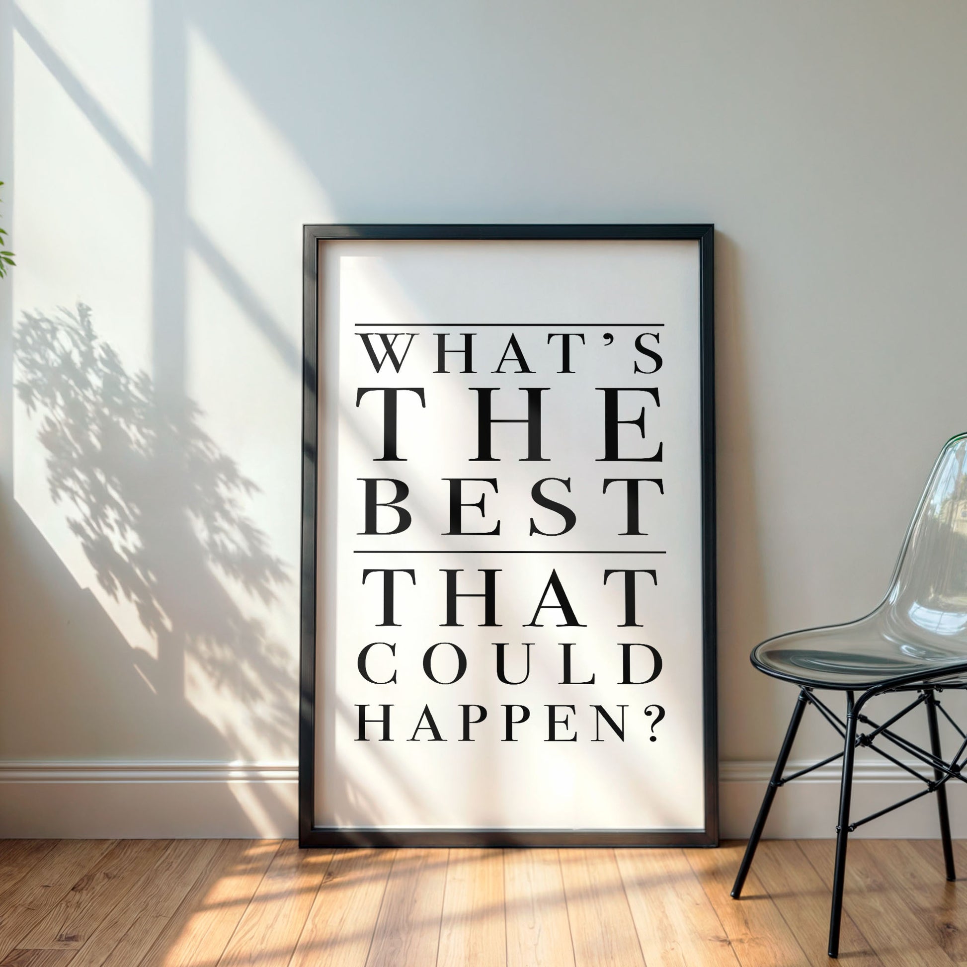 Framed poster with motivational quote 'What's the best that could happen?' in a room with a chair and sunlight.
