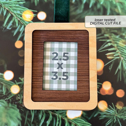 A square wooden laser-cut hanging ornament with a dark wood-grain center panel and a light natural wood frame, featuring a sample gingham insert that reads 2.5 x 3.5.