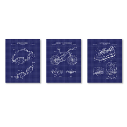 Three blueprints of swim goggles, a bicycle, and a running shoe on a white background.