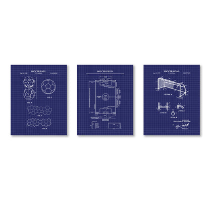 Three vertical blueprint-style wall art prints on a white background, each showing a soccer-related patent drawing: soccer ball, soccer field, and soccer goal. The prints are dark blue with white linework and text.
