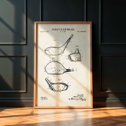 Framed golf club head patent print on a wall with wooden floor
