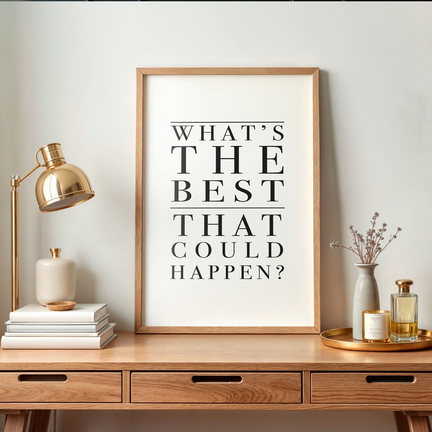 Framed poster with motivational quote on a wooden desk with decorative items.