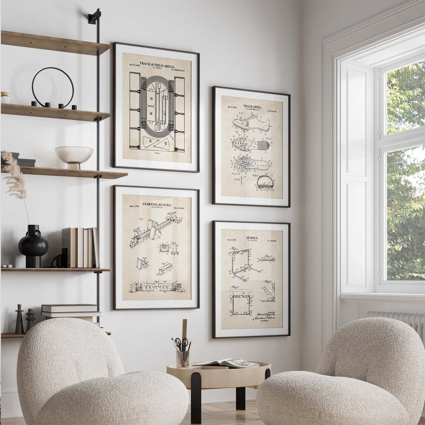 Modern living room with framed track and field patent drawings on the wall, two armchairs, and a window.