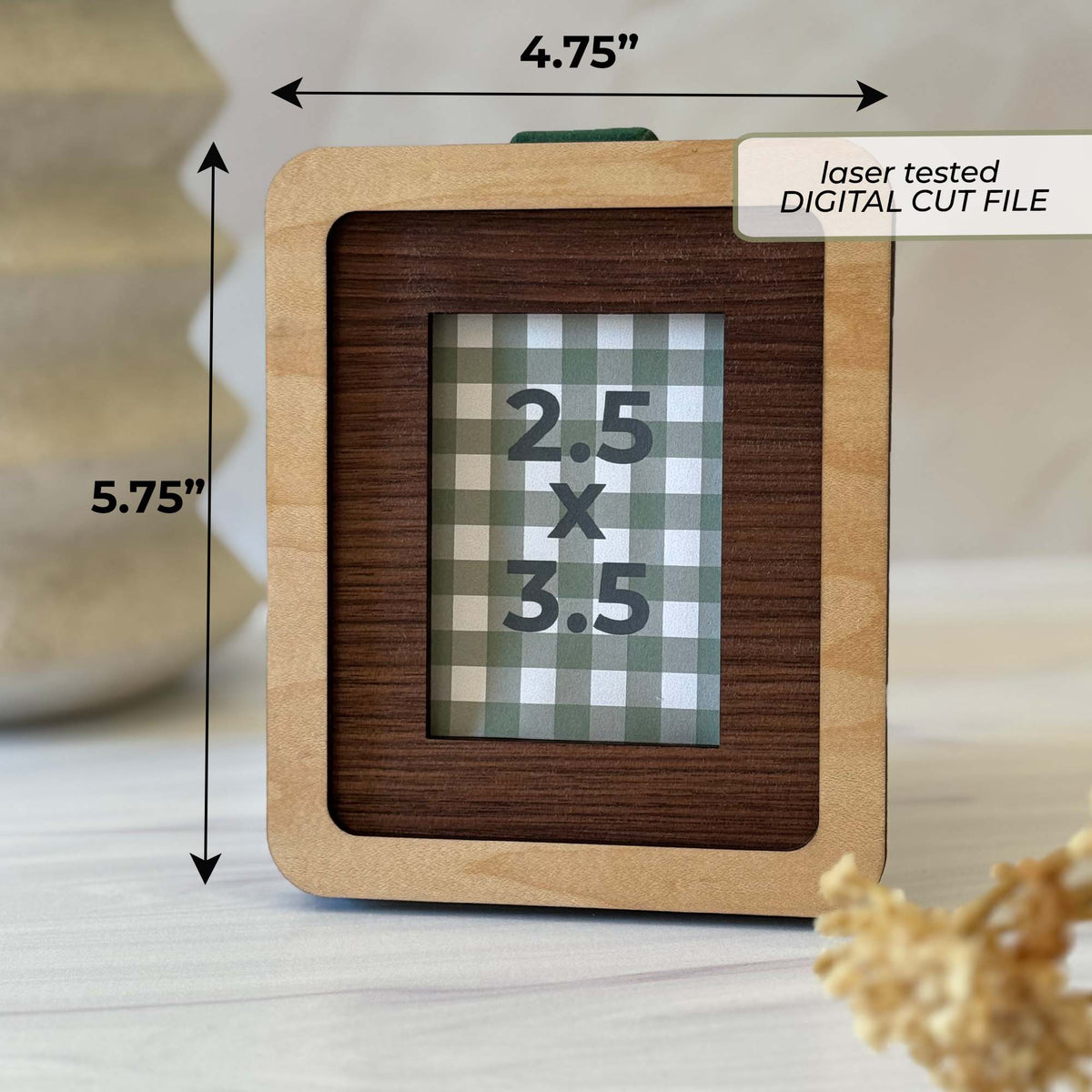 A square wooden picture frame shown on a tabletop with dimension arrows and text indicating 4.75 by 5.75.