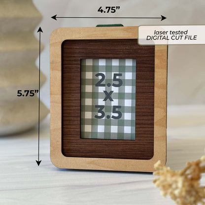 A square wooden picture frame shown on a tabletop with dimension arrows and text indicating 4.75 by 5.75.