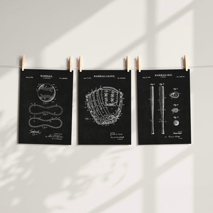 Three black baseball-themed patent art prints clipped to a white wall with wooden clothespins, shown in a styled interior setting with soft window shadow overlays.