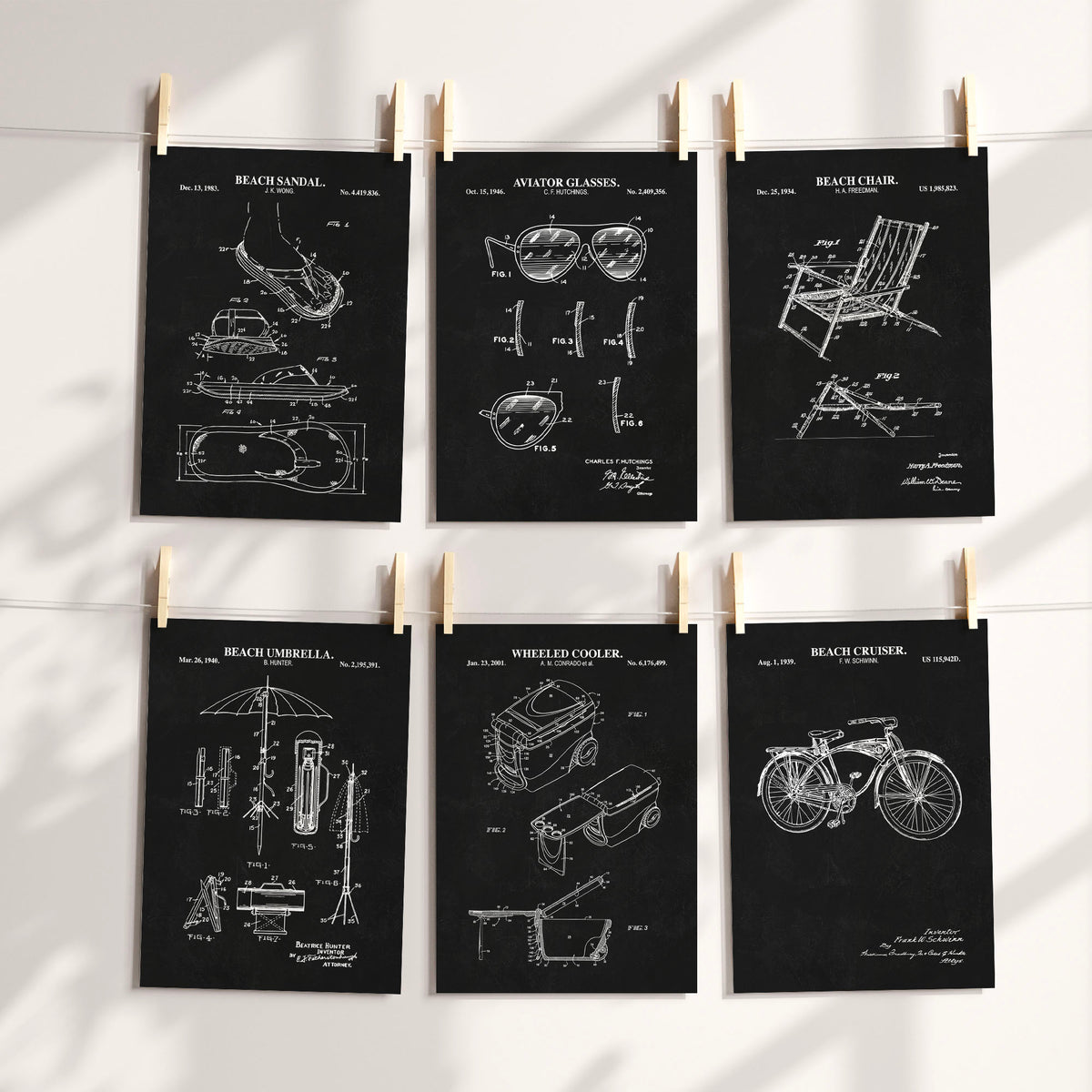 Six dark chalkboard technical prints of beach gear with white printed graphic