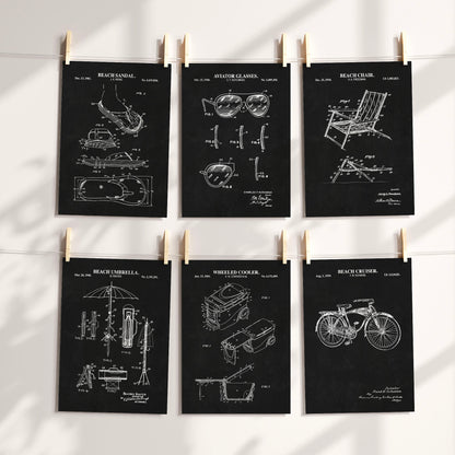Six dark chalkboard technical prints of beach gear with white printed graphic