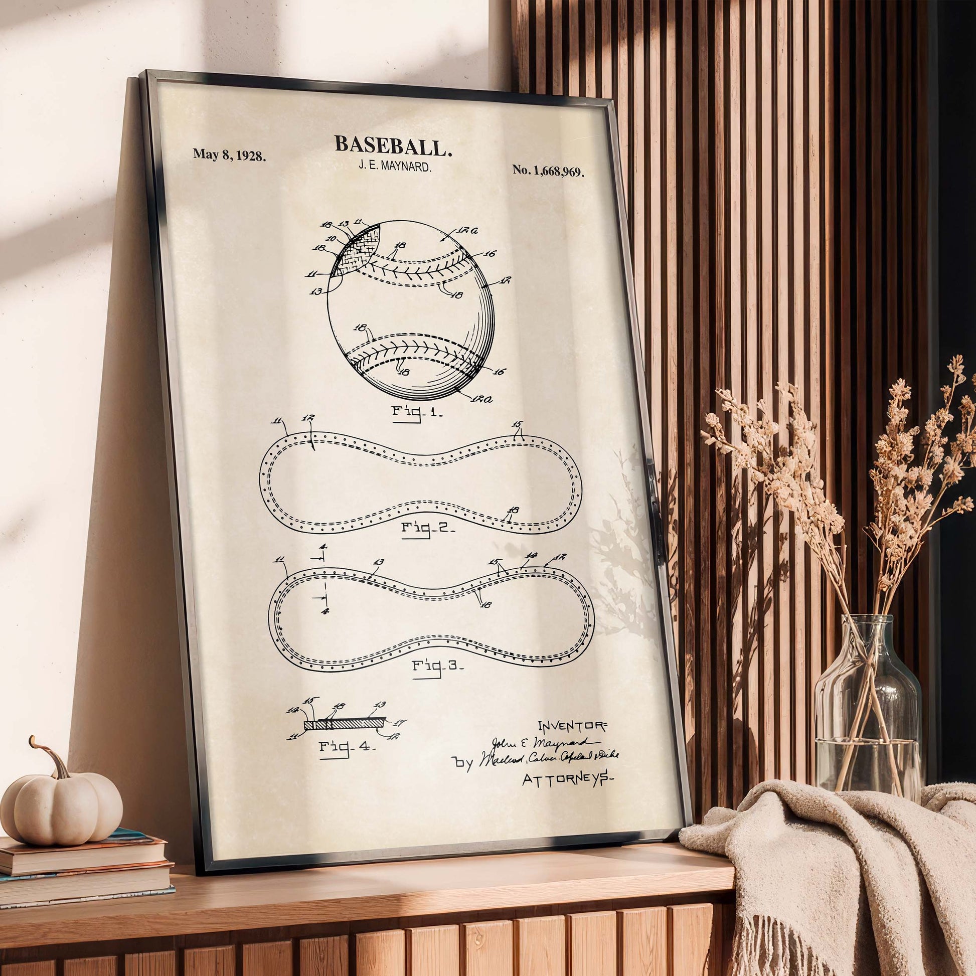 Framed baseball patent poster on a wooden surface with decorative elements.