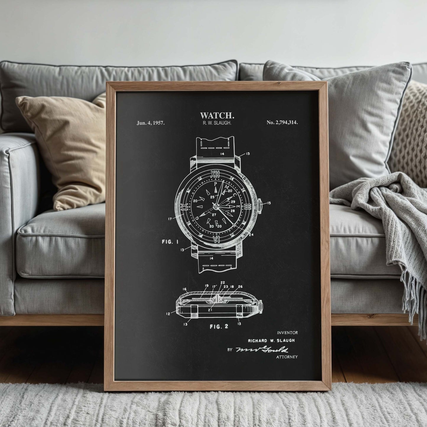 Framed watch patent print with a couch in the background