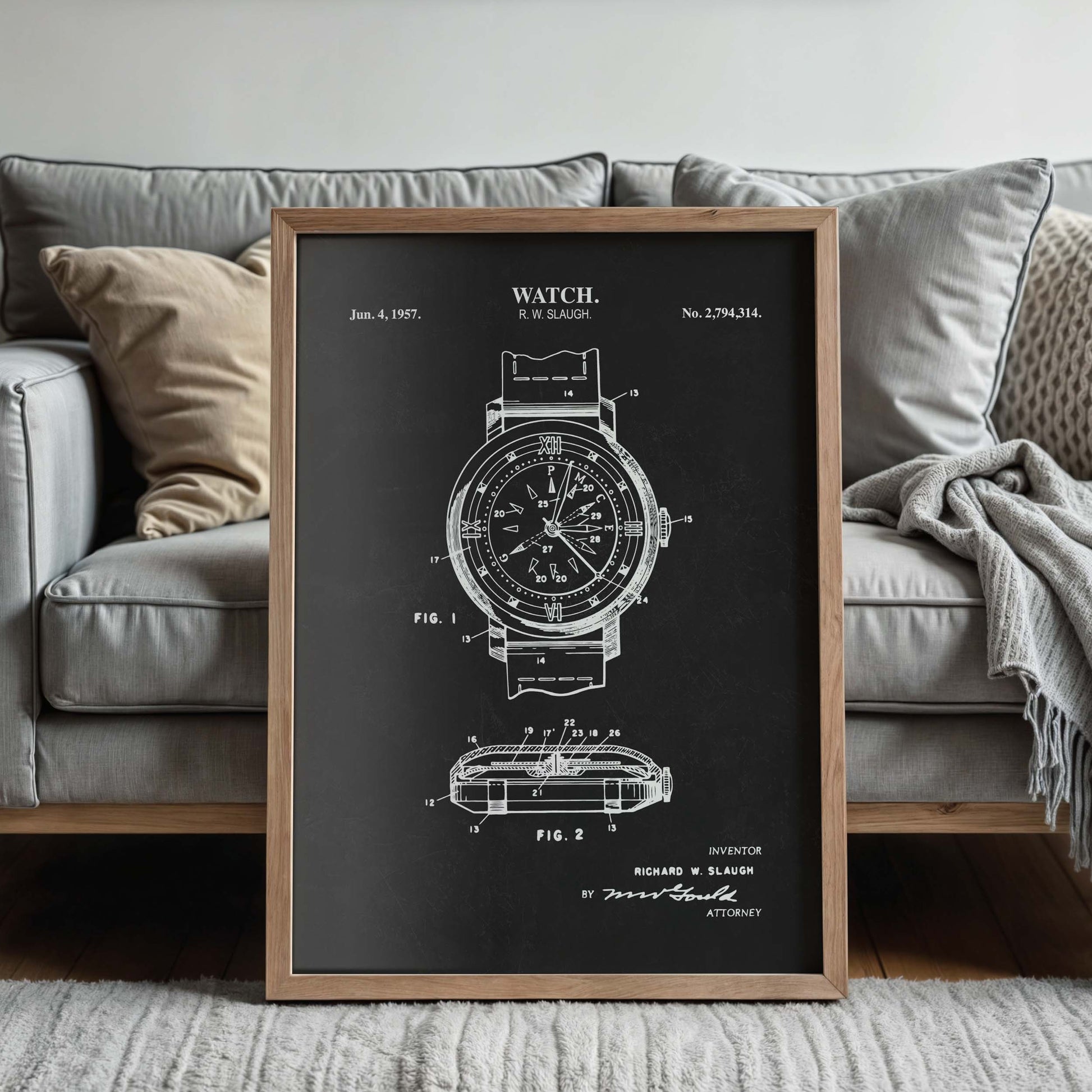 Framed watch patent print with a couch in the background