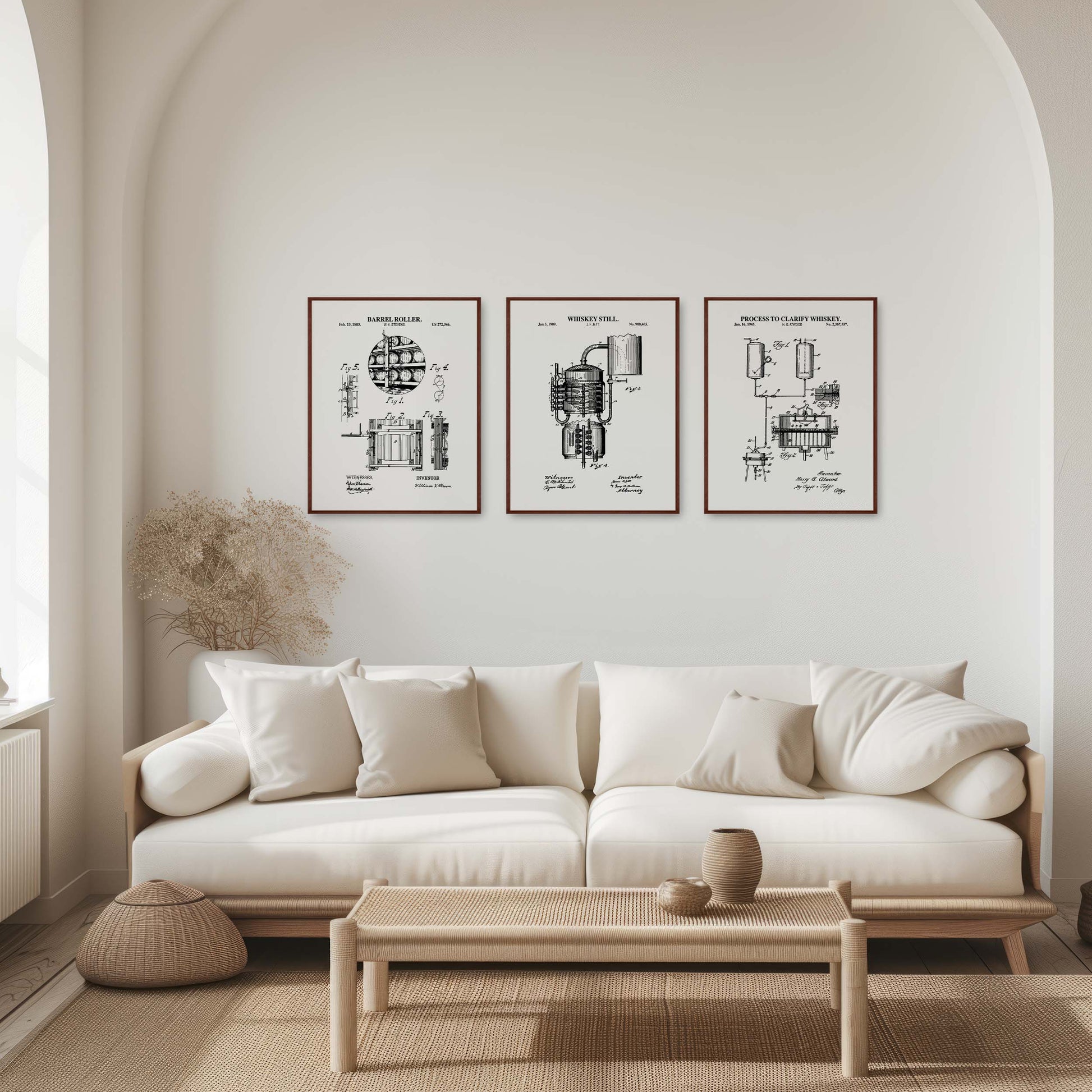 Modern living room with a white sofa, coffee table, and framed black and white prints on the wall.