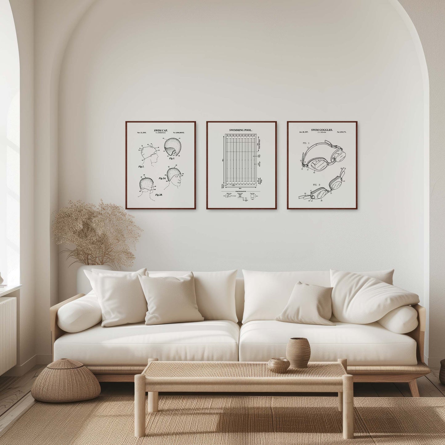 Modern living room with a white sofa, coffee table, and framed black and white prints on the wall.