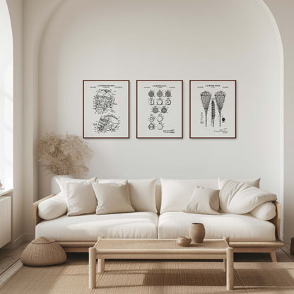 Modern living room with a white sofa, coffee table, and framed lacrosse artwork on the wall.