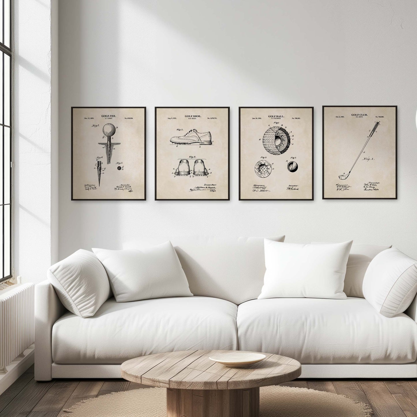 White sofa in a living room with four framed golf posters on the wall.