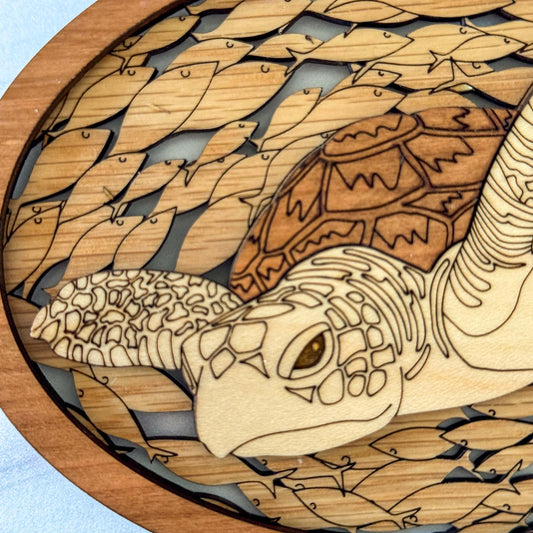 Wooden turtle and fish design on a light background