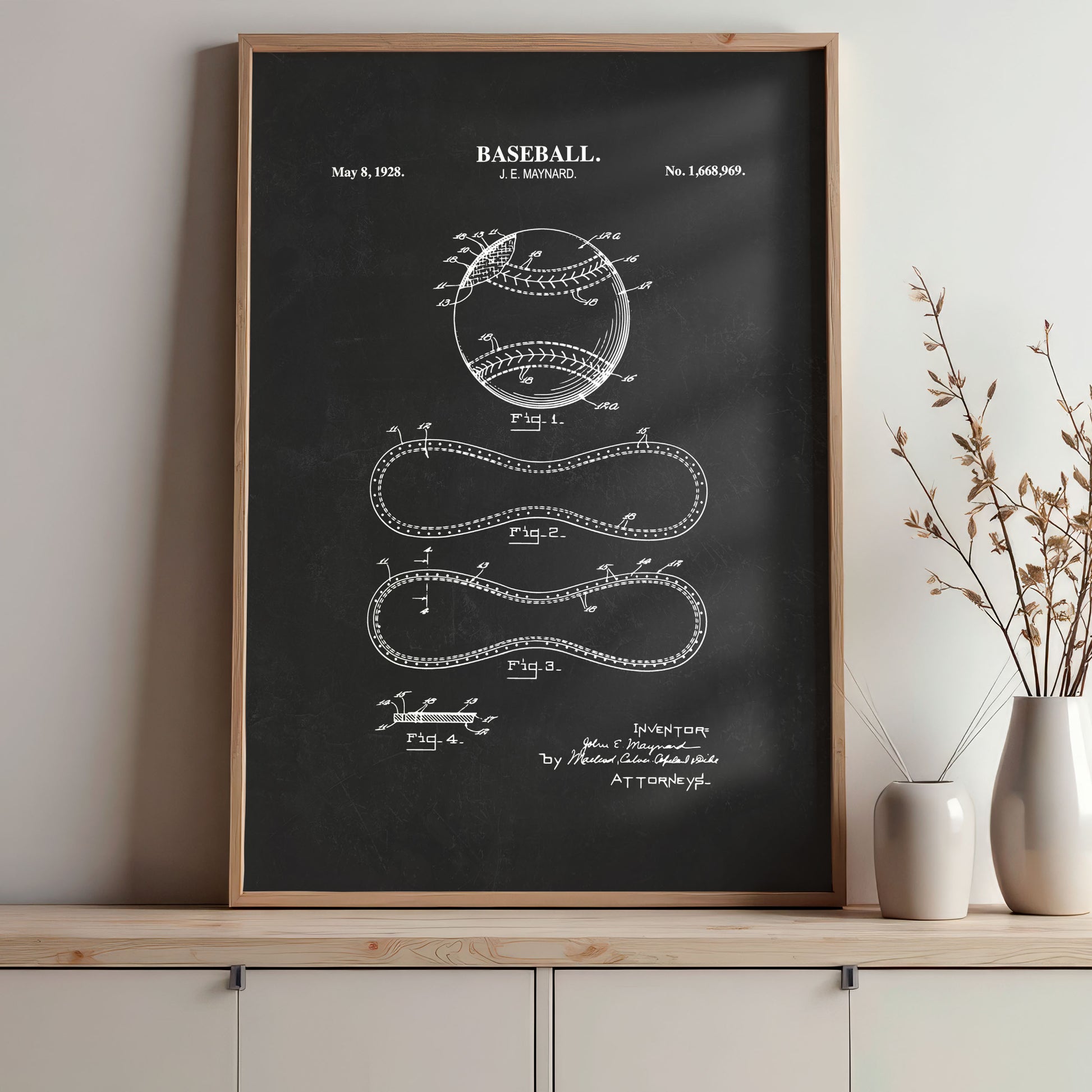 Framed baseball patent poster on a wall with decorative elements.