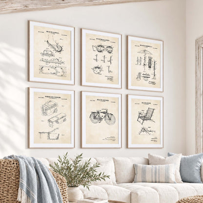 Coastal gallery wall featuring six vintage beach gear patent prints of a sandal, sunglasses, cooler, umbrella, cruiser bicycle and folding chair.