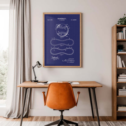 Home office with a desk, chair, and framed football patent print on the wall.