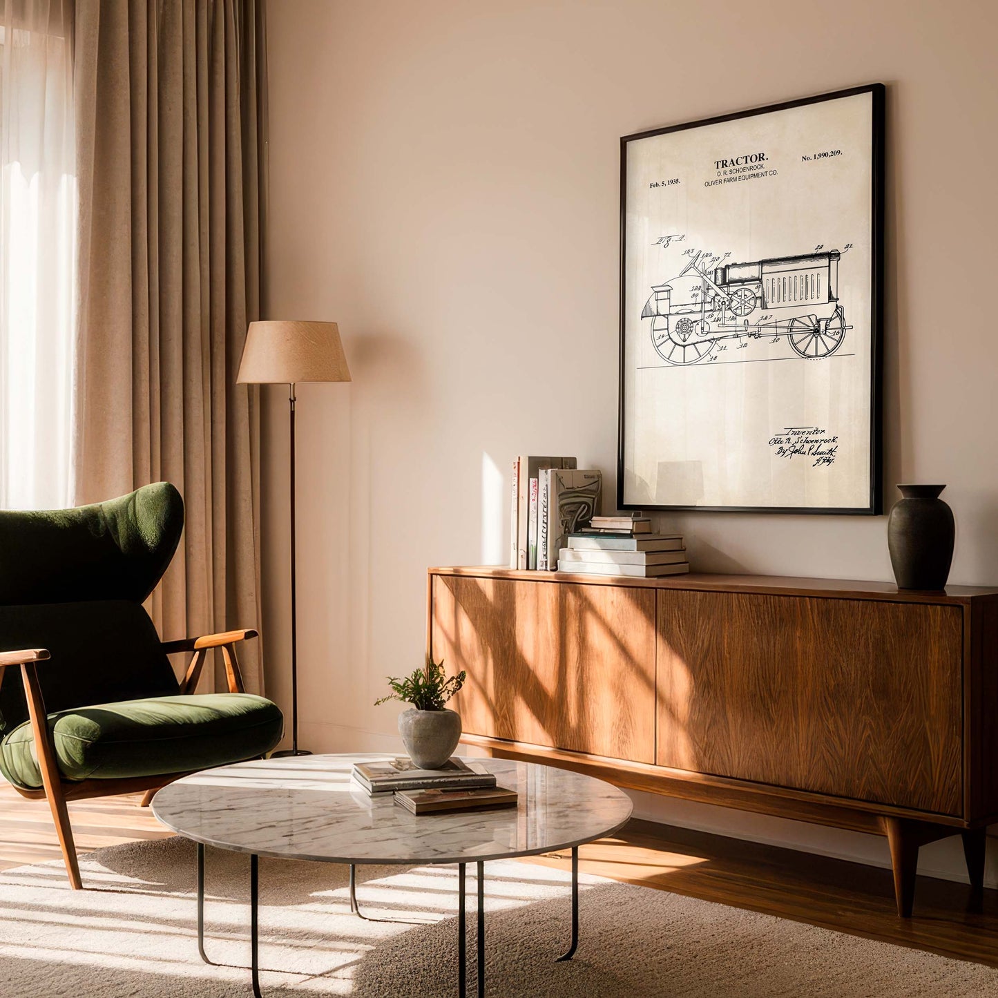 Modern living room with a green armchair, wooden sideboard, and framed tractor blueprint.