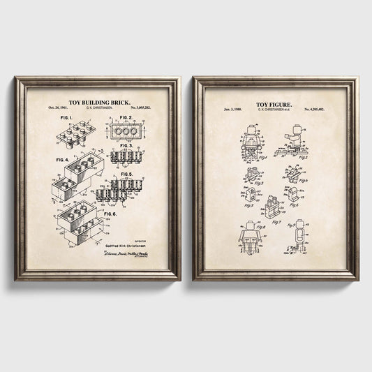 Set of two vintage toy brick patent prints featuring a building brick and coordinating toy figure in silver frames.