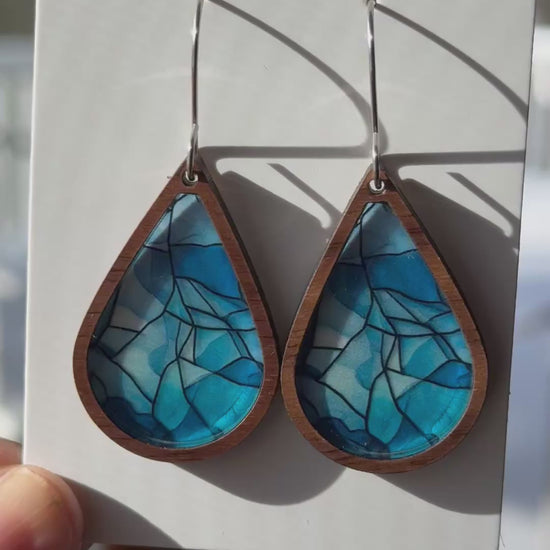 Video showing the faux stained glass earrings with light shining through them
